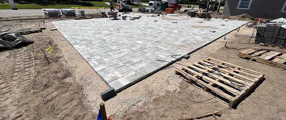 Installing a new paver driveway midway through the project at a property in Bartow, FL.